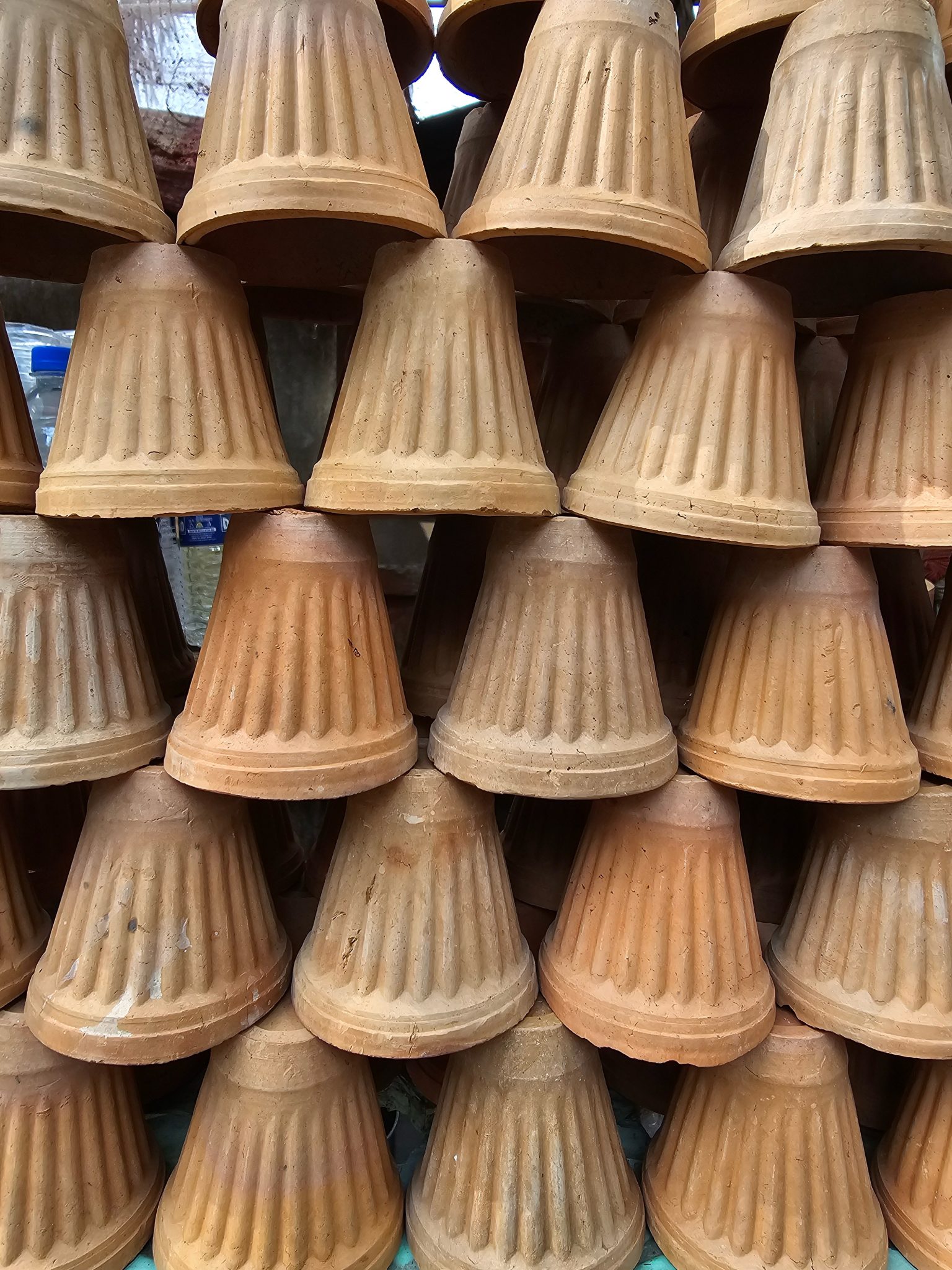 Clay pots stacked in a workshop
